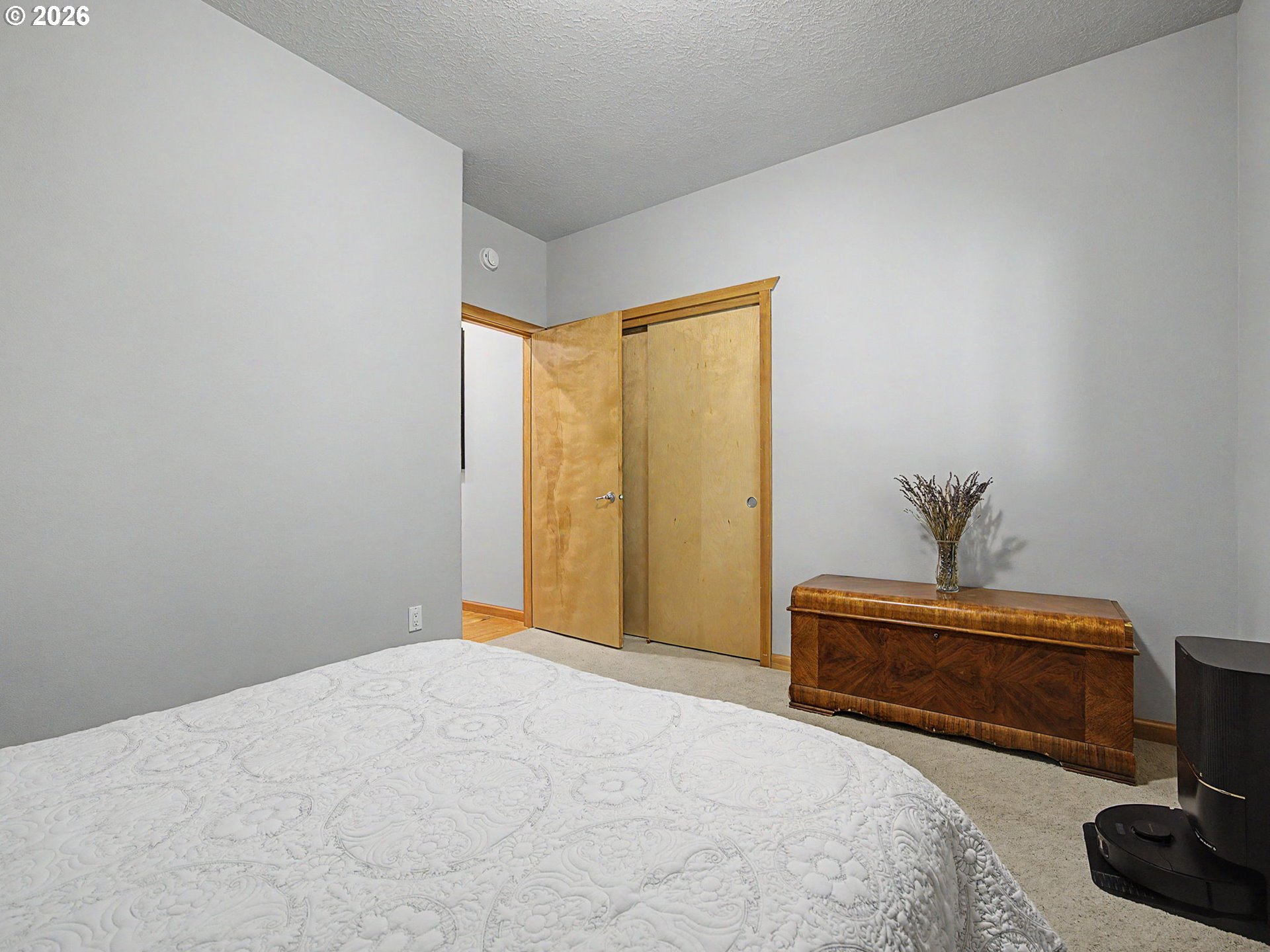23491 East Lolo Pass Road Rhododendron, OR 97049 - Photo 30 of 47 a bedroom with a bed and a potted plant