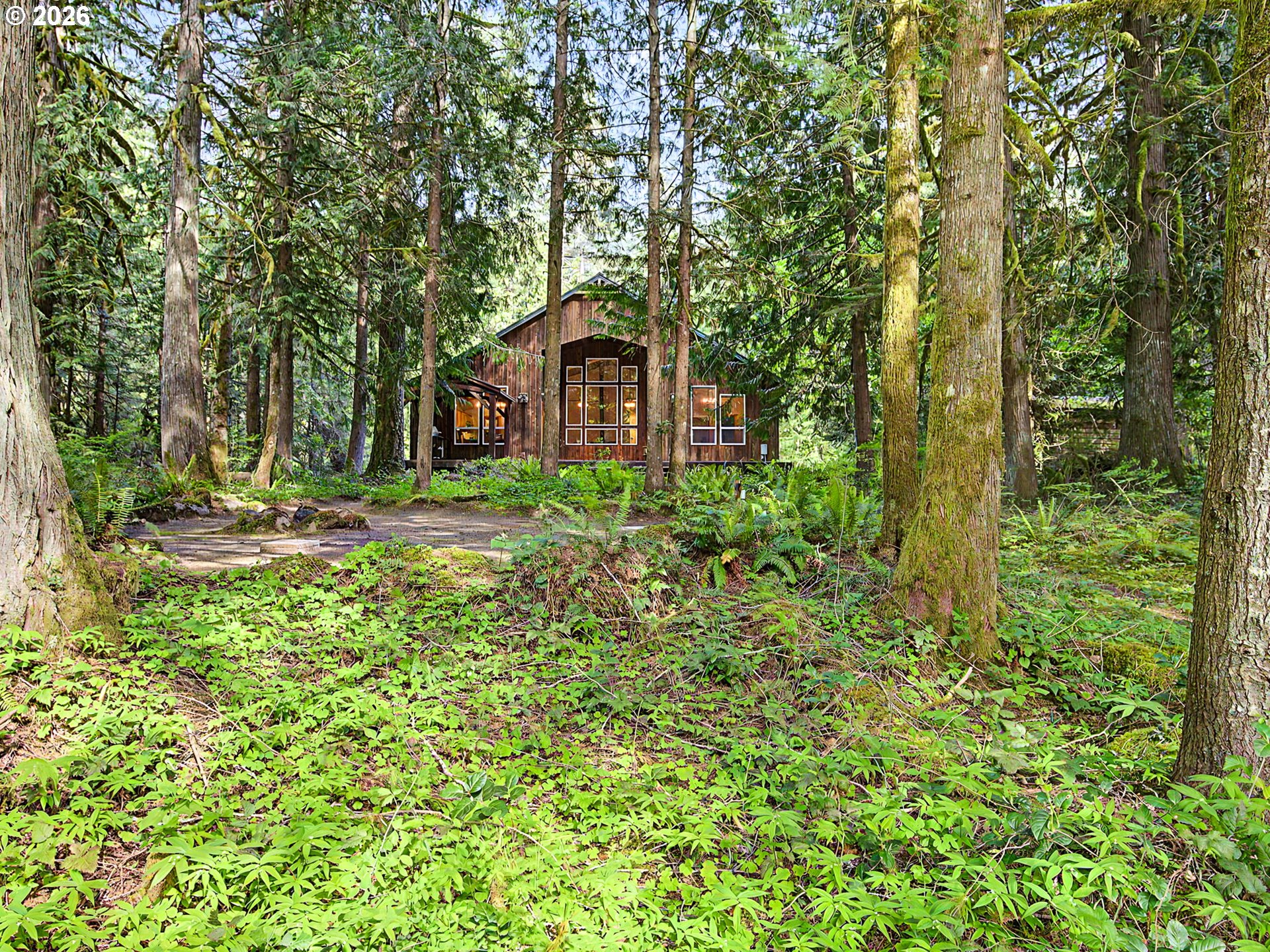 23491 East Lolo Pass Road Rhododendron, OR 97049 - Photo 39 of 47 a view of a garden with large trees