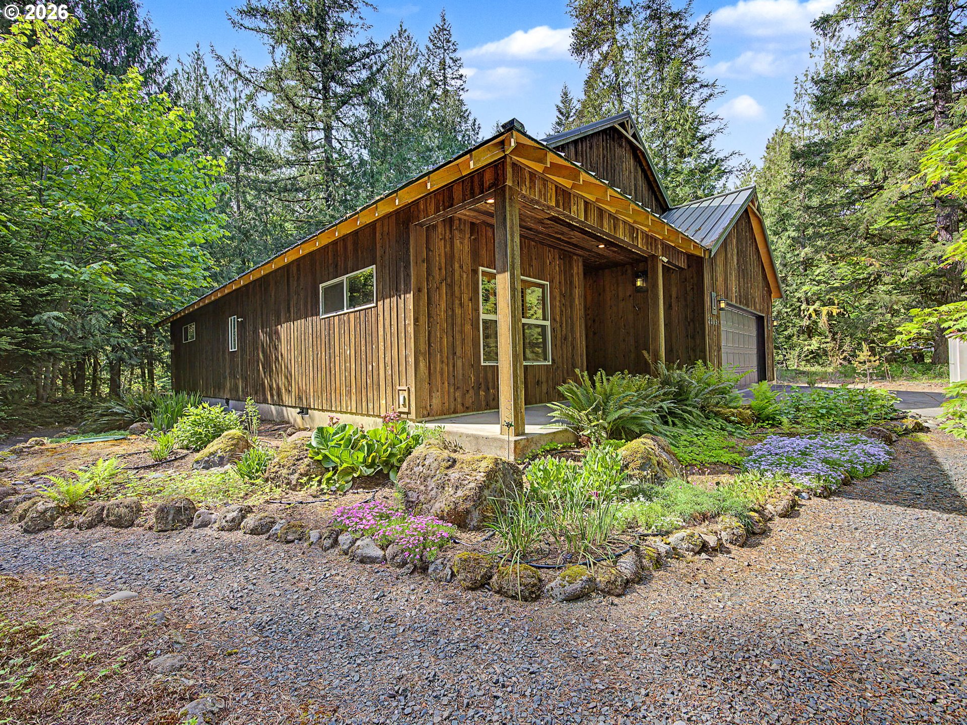 23491 East Lolo Pass Road Rhododendron, OR 97049 - Photo 40 of 47 a view of a house with a yard and plants
