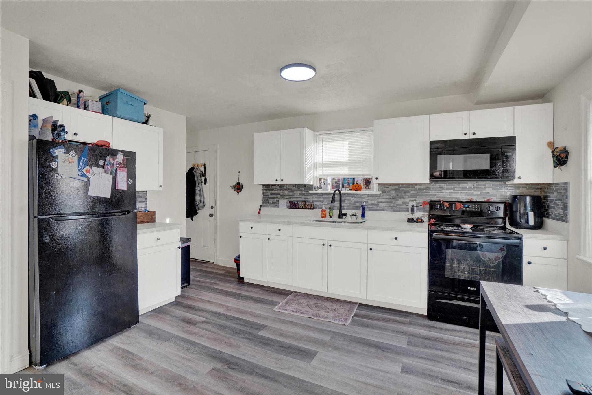 1305 Lancaster Avenue York, PA 17403 - Photo 5 of 18 a kitchen with stainless steel appliances a refrigerator stove microwave and sink