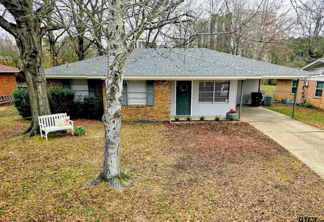 a view of a house with backyard porch and sitting area