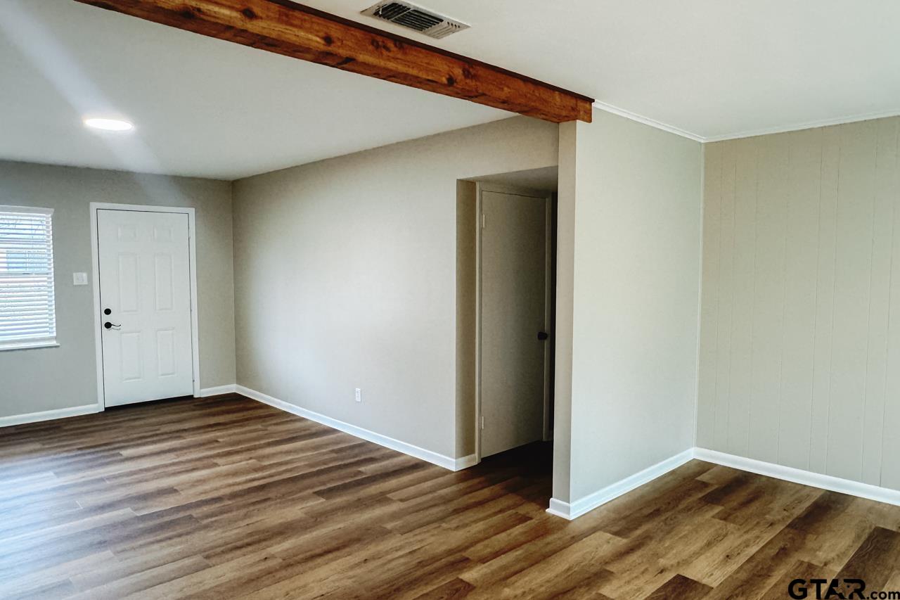 3131 Greg Lane Tyler, TX 75701 - Photo 24 of 47 a view of an empty room with wooden floor