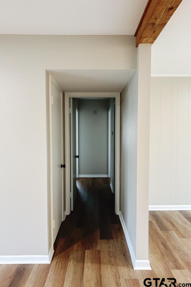 3131 Greg Lane Tyler, TX 75701 - Photo 25 of 47 a view of a hallway with wooden floor and staircase