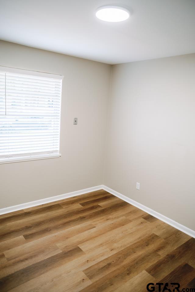 3131 Greg Lane Tyler, TX 75701 - Photo 30 of 47 a view of a room with wooden floor and a window
