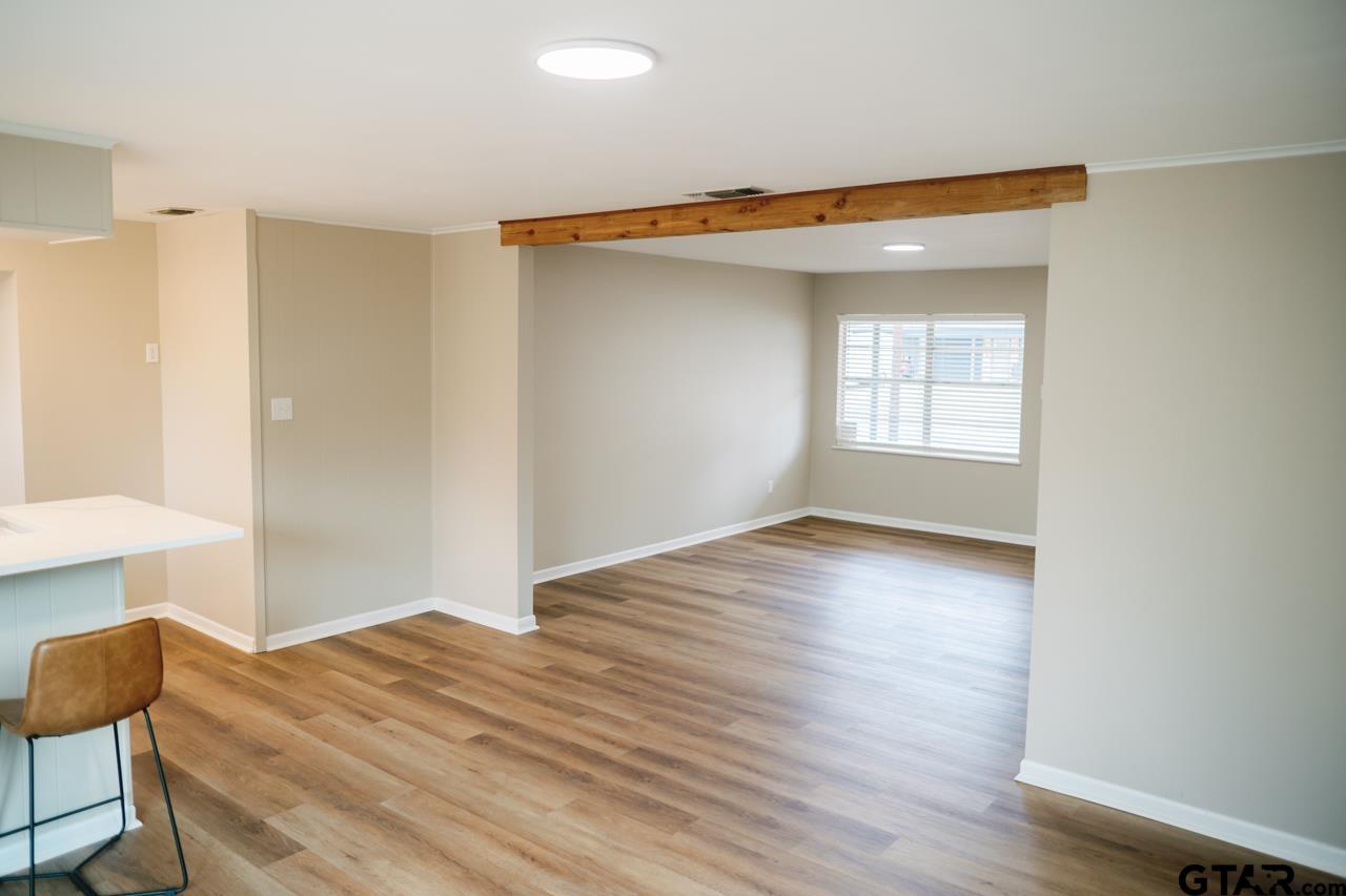 3131 Greg Lane Tyler, TX 75701 - Photo 7 of 47 a view of empty room with wooden floor and fan