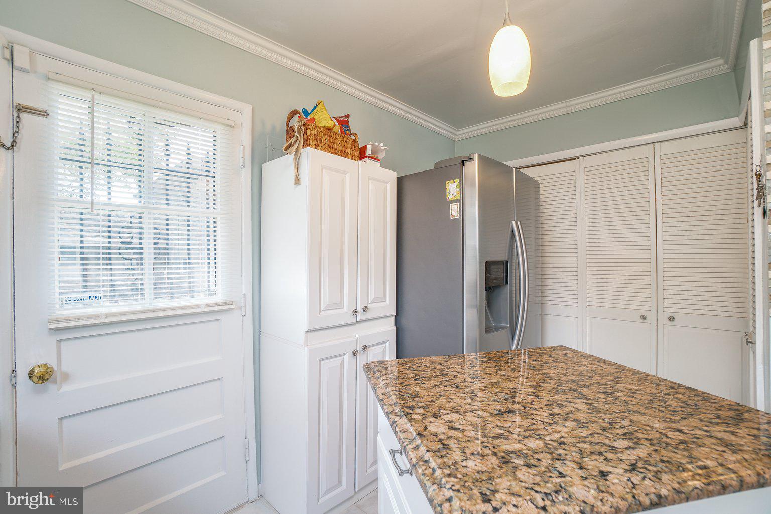 5922 Robindale Road Baltimore, MD 21228 - Photo 11 of 29 Kitchen, Laundry area behind louvered doors