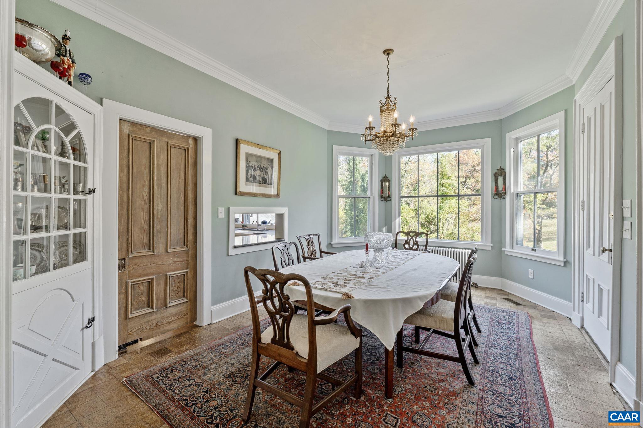 5515 Gordonsville Road Keswick, VA 22947 - Photo 19 of 74 a view of a dining room with furniture window and wooden floor
