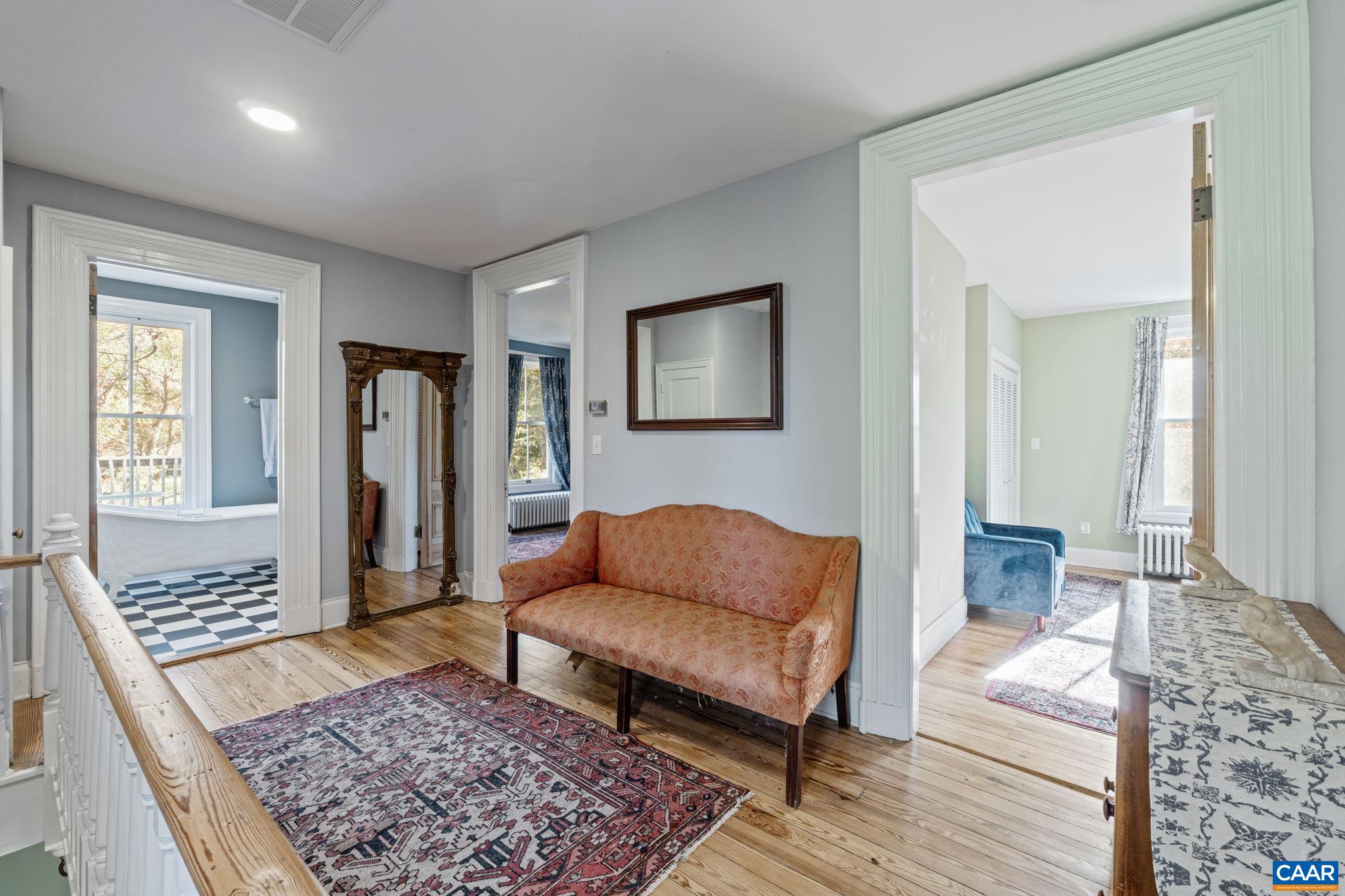 5515 Gordonsville Road Keswick, VA 22947 - Photo 32 of 74 a living room with furniture and a rug