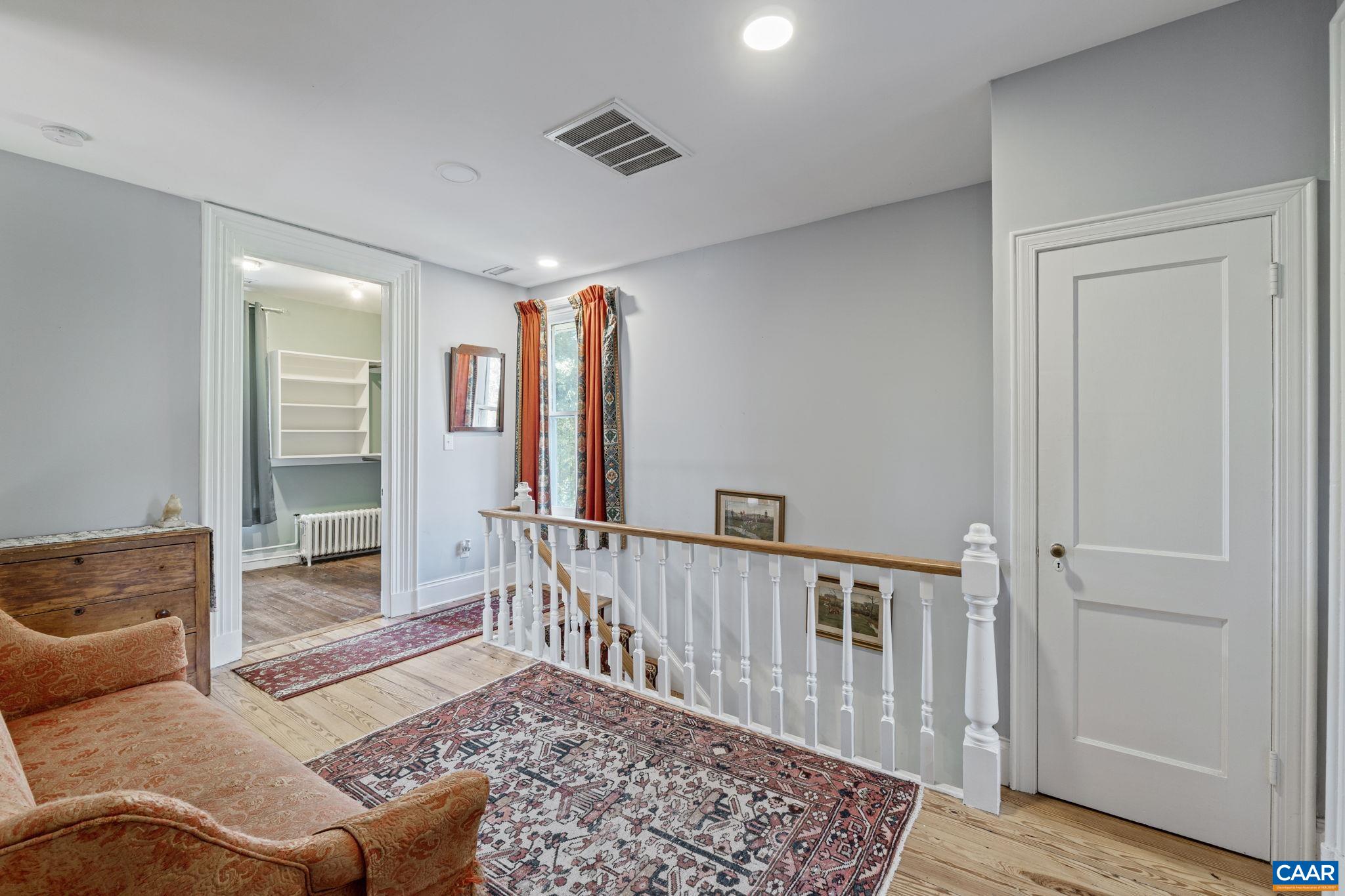 5515 Gordonsville Road Keswick, VA 22947 - Photo 33 of 74 a living room with furniture and a rug