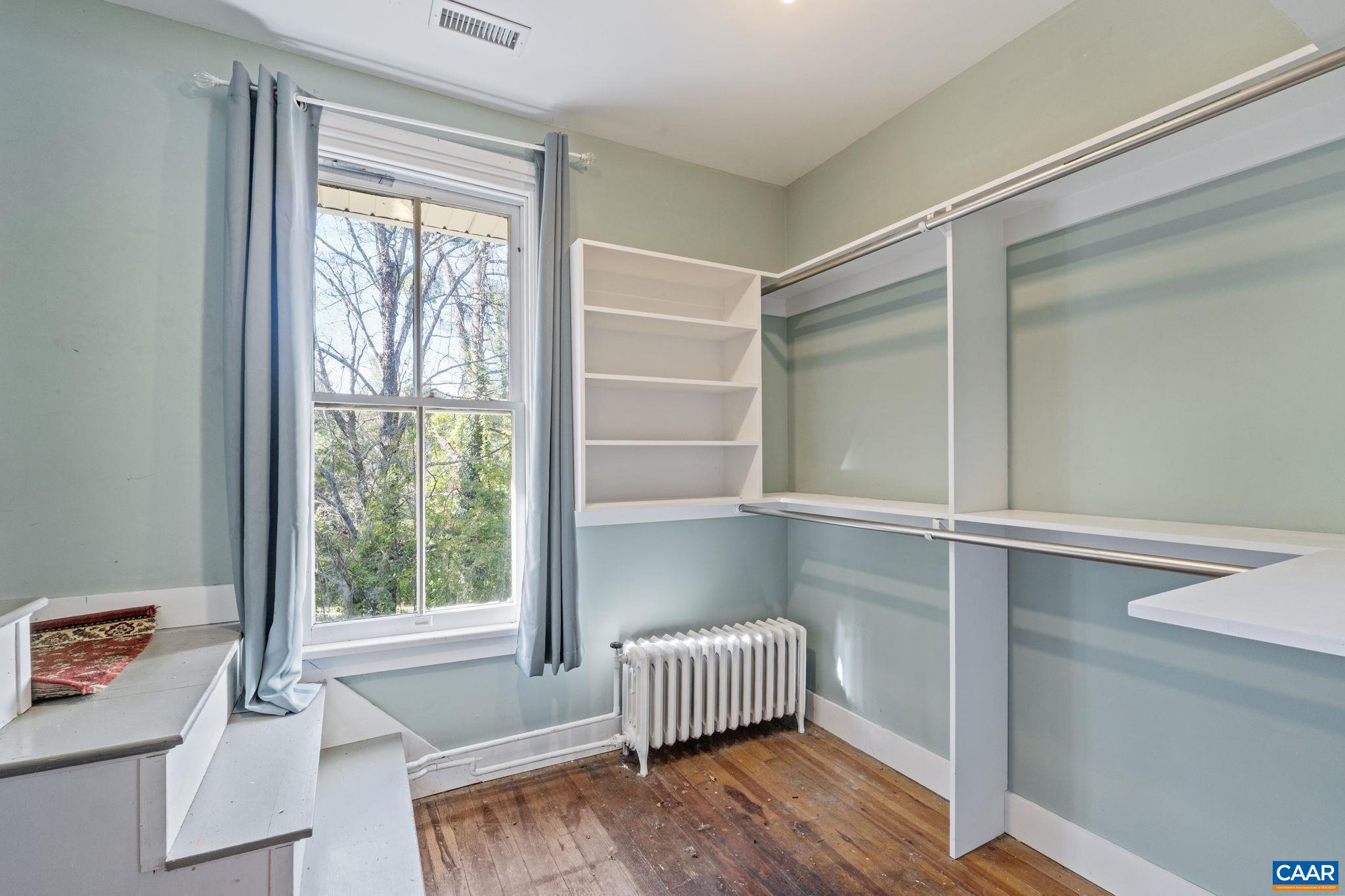 5515 Gordonsville Road Keswick, VA 22947 - Photo 40 of 74 a room with a window and wooden floor