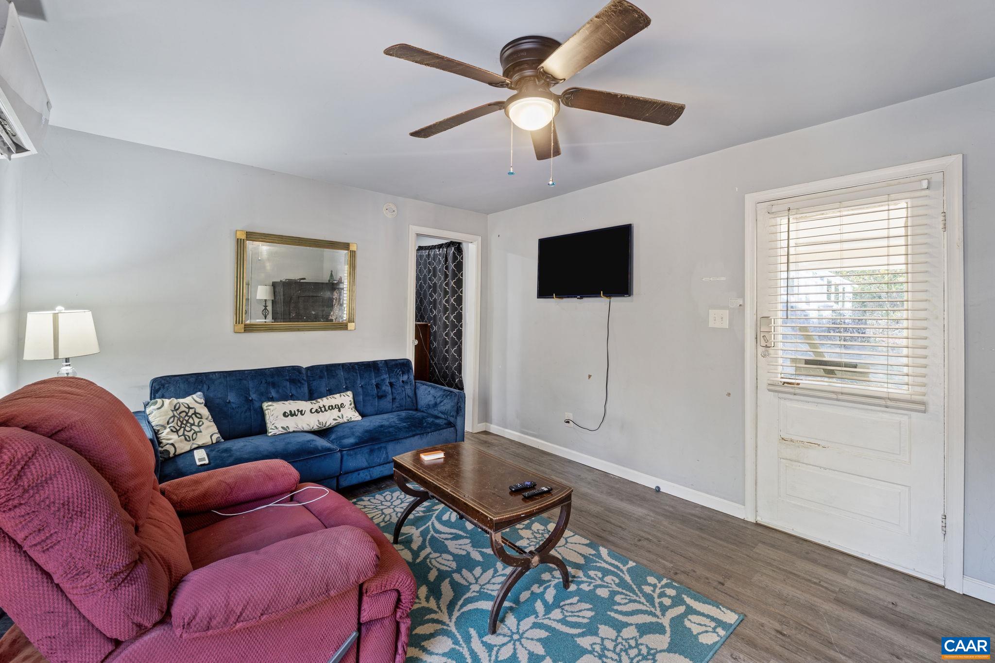 5515 Gordonsville Road Keswick, VA 22947 - Photo 51 of 74 a living room with furniture and a flat screen tv