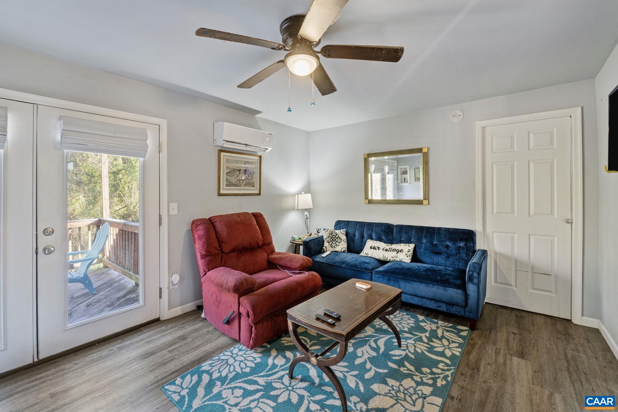 5515 Gordonsville Road Keswick, VA 22947 - Photo 52 of 74 a living room with furniture and wooden floor