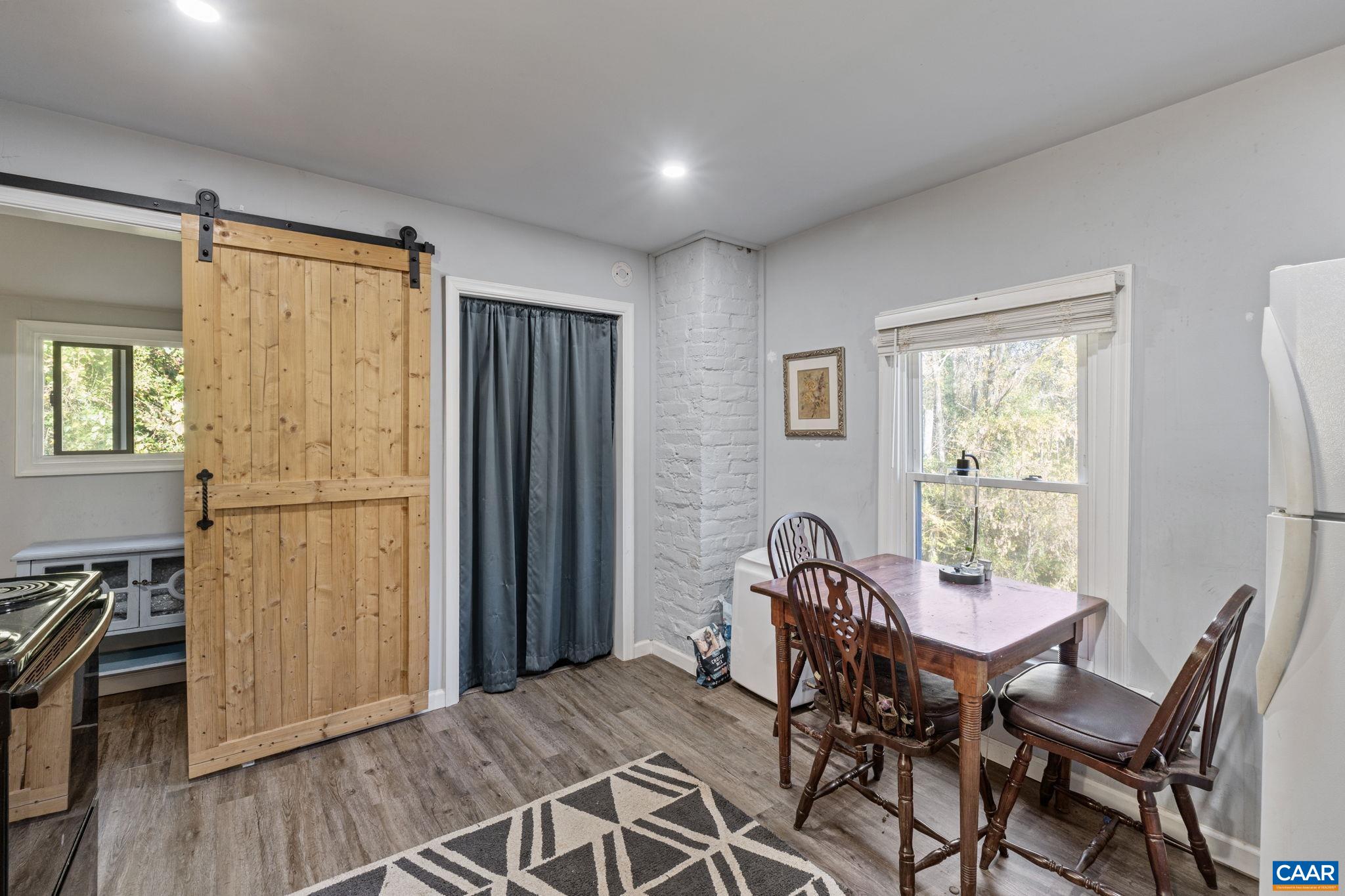 5515 Gordonsville Road Keswick, VA 22947 - Photo 54 of 74 a view of a dining room with furniture and a window