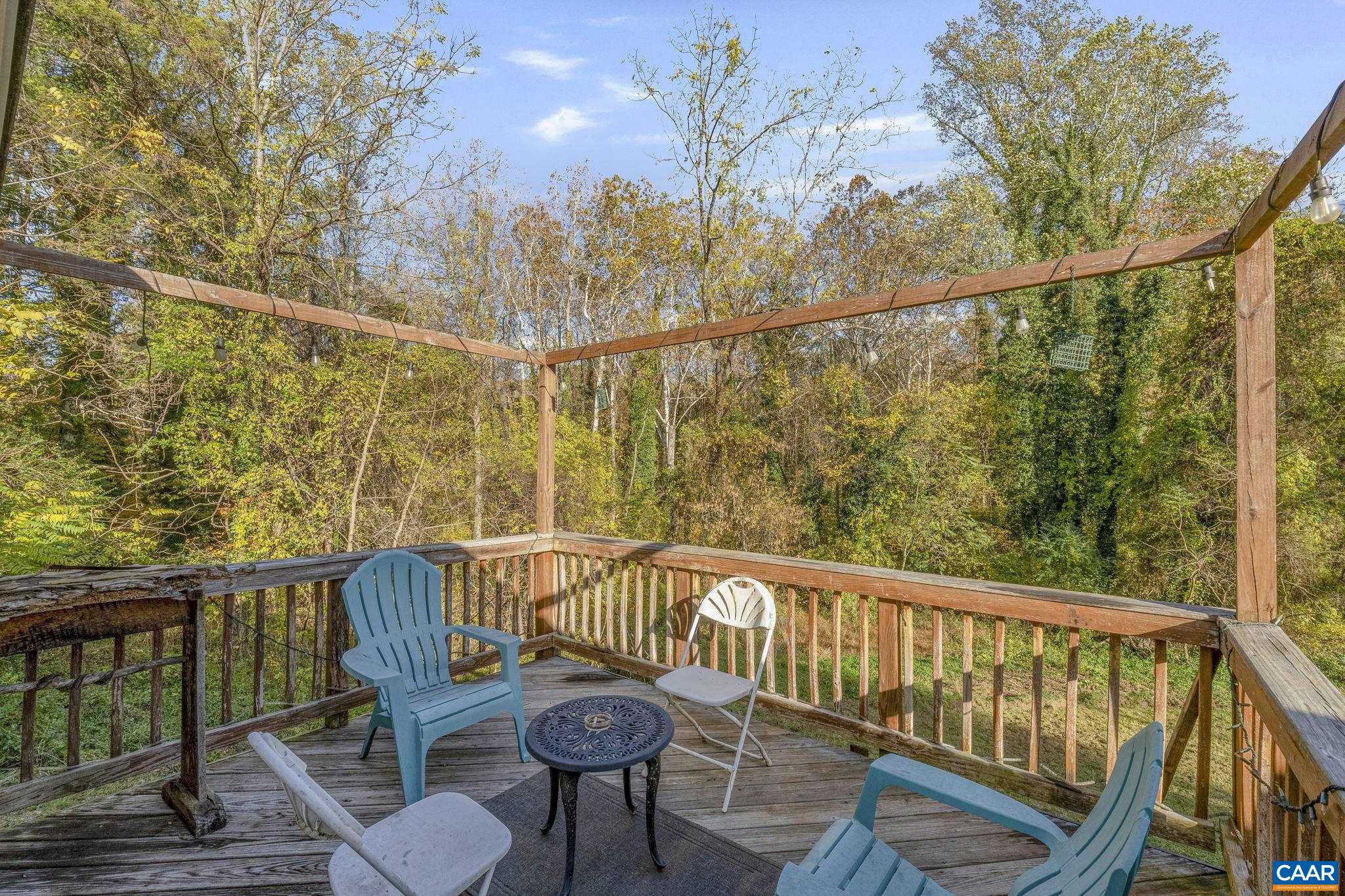 5515 Gordonsville Road Keswick, VA 22947 - Photo 58 of 74 a view of a balcony with wooden floor and iron fence