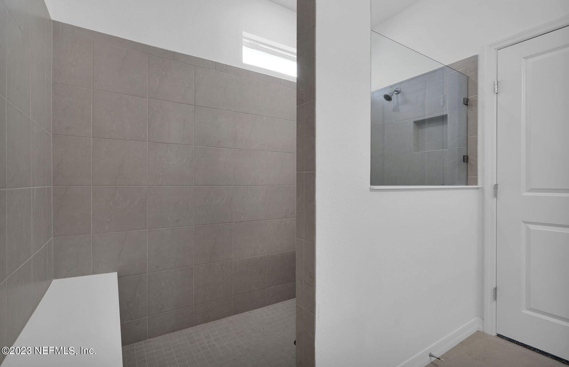 357 Muhly Grass Street Yulee, FL 32097 - Photo 14 of 20 a bathroom with a shower and vanity