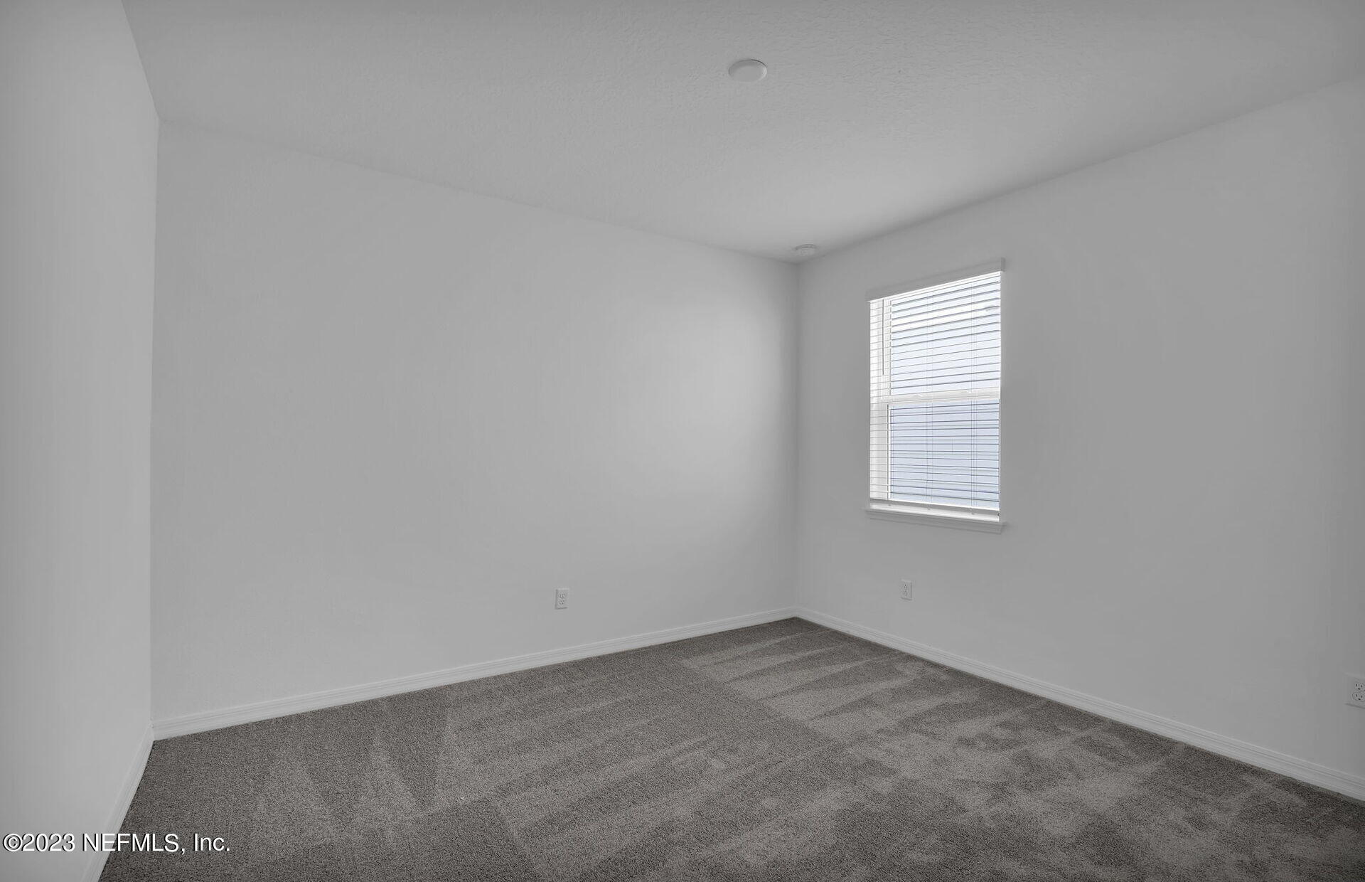 357 Muhly Grass Street Yulee, FL 32097 - Photo 16 of 20 an empty room with a window