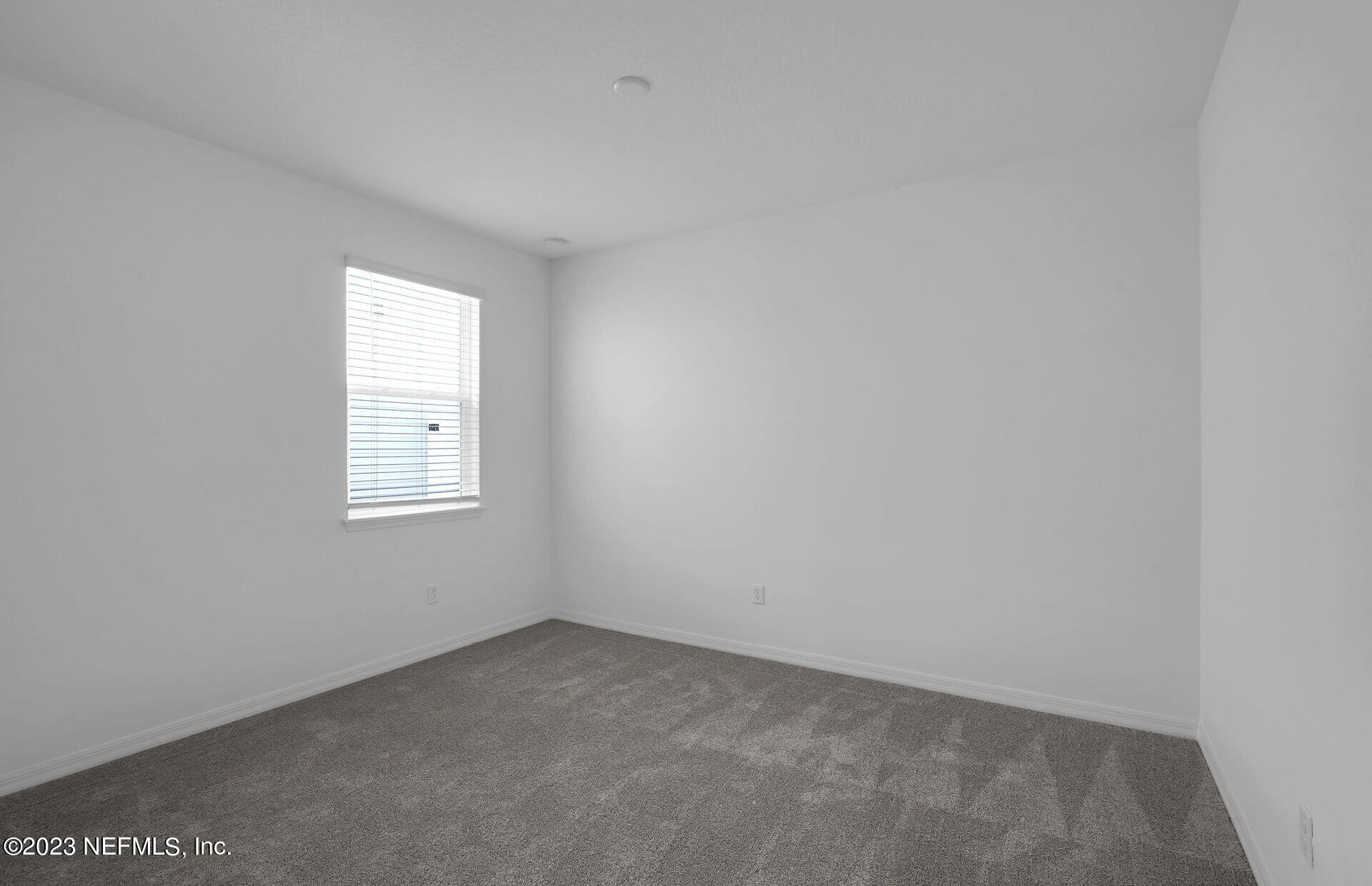 357 Muhly Grass Street Yulee, FL 32097 - Photo 18 of 20 an empty room with a window