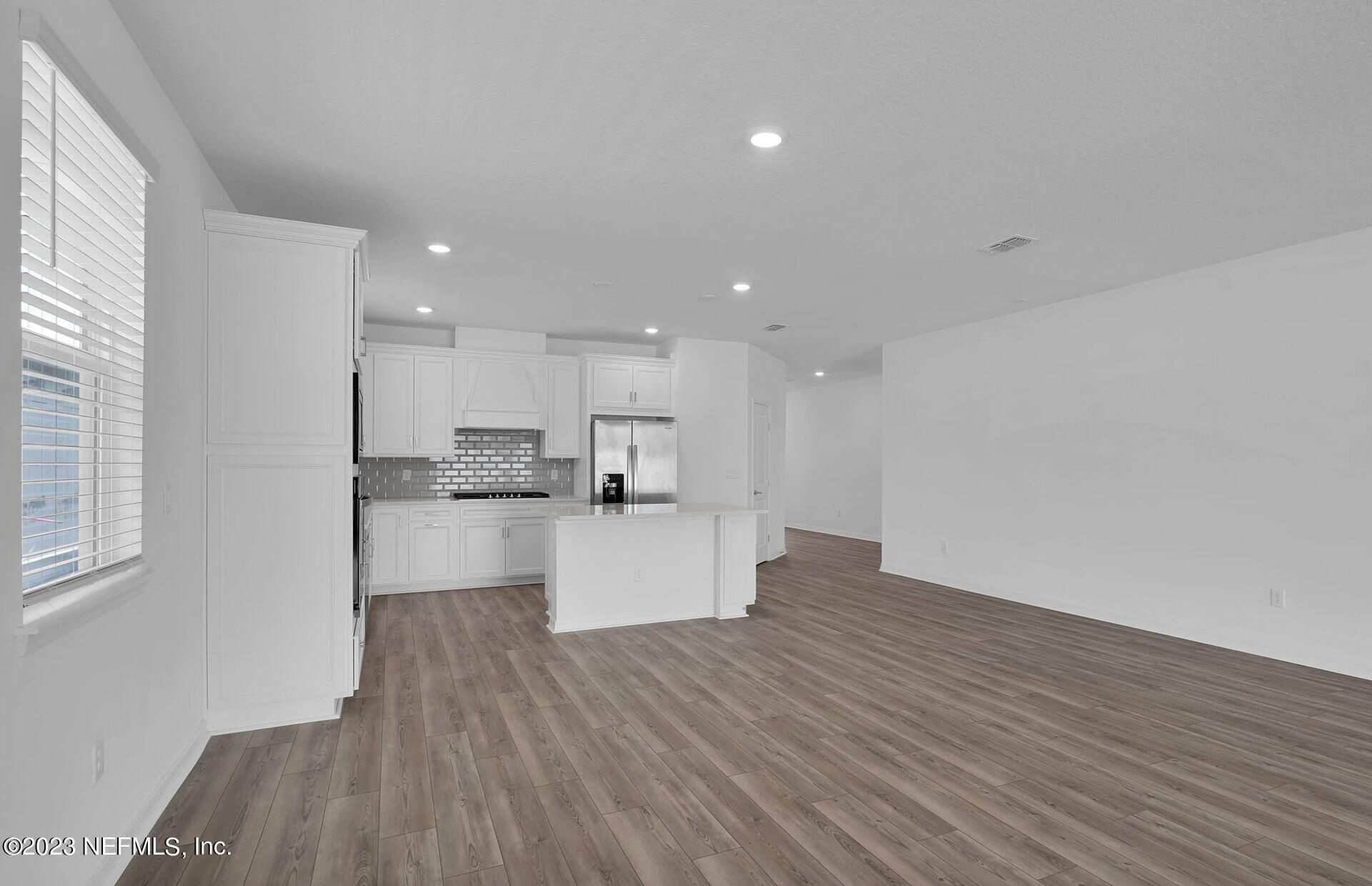 357 Muhly Grass Street Yulee, FL 32097 - Photo 9 of 20 a view of kitchen with wooden floor