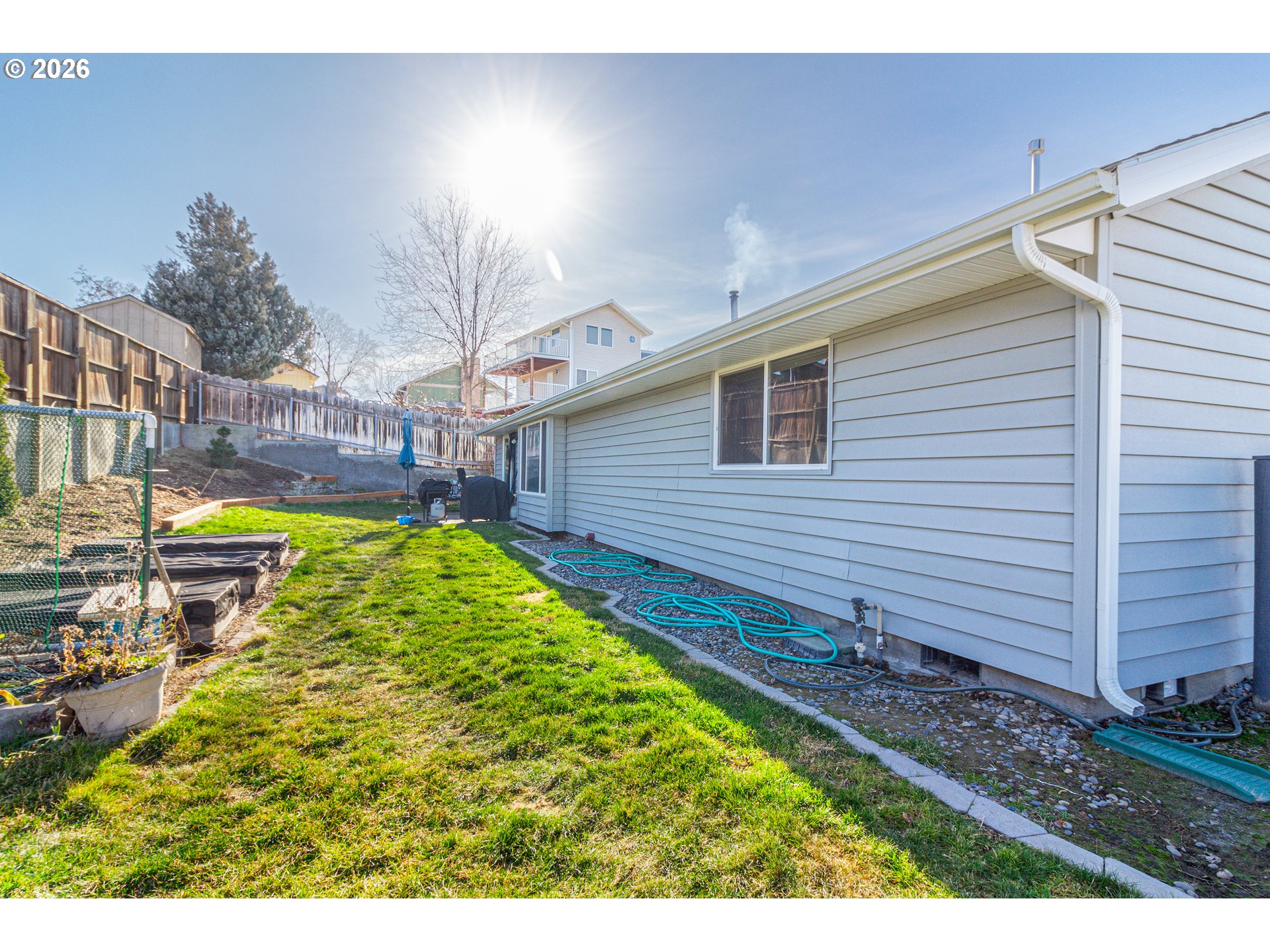 305 Southeast 9th Drive Hermiston, OR 97838 - Photo 5 of 28 a view of a backyard with a garden