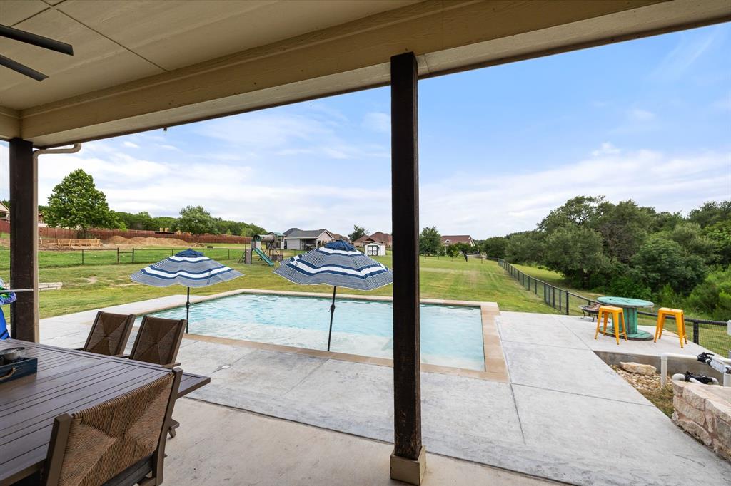 2103 Cash Point Court Granbury, TX 76049 - Photo 31 of 38 a view of swimming pool with lake view and mountain view