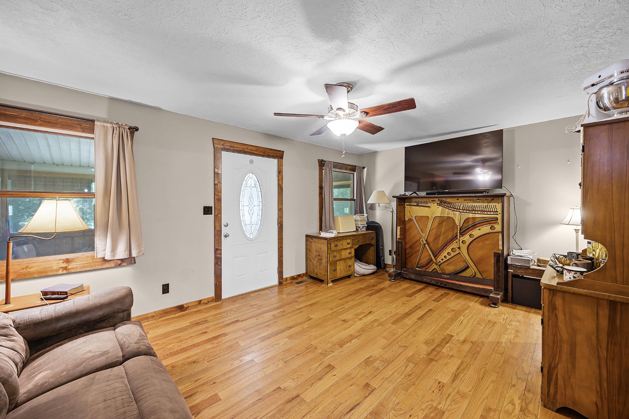 301 Killebrew Road Springville, TN 38256 - Photo 2 of 11 a bedroom with furniture and a flat screen tv
