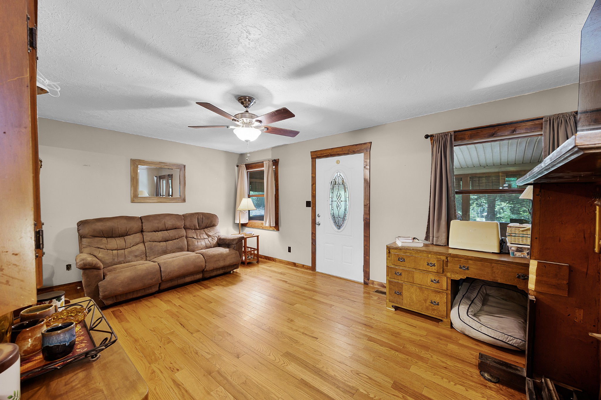 301 Killebrew Road Springville, TN 38256 - Photo 3 of 11 a living room with furniture and a wooden floor