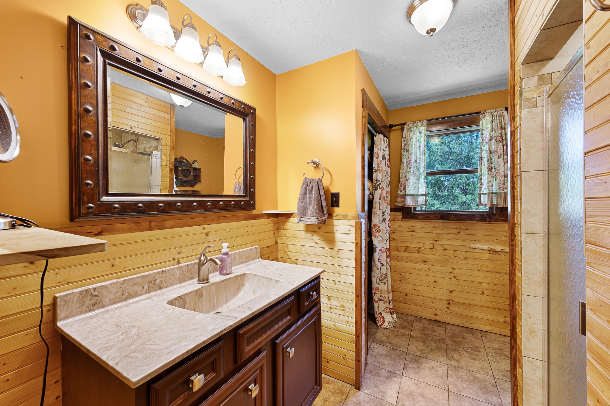 301 Killebrew Road Springville, TN 38256 - Photo 7 of 11 a bathroom with a sink a vanity and a mirror