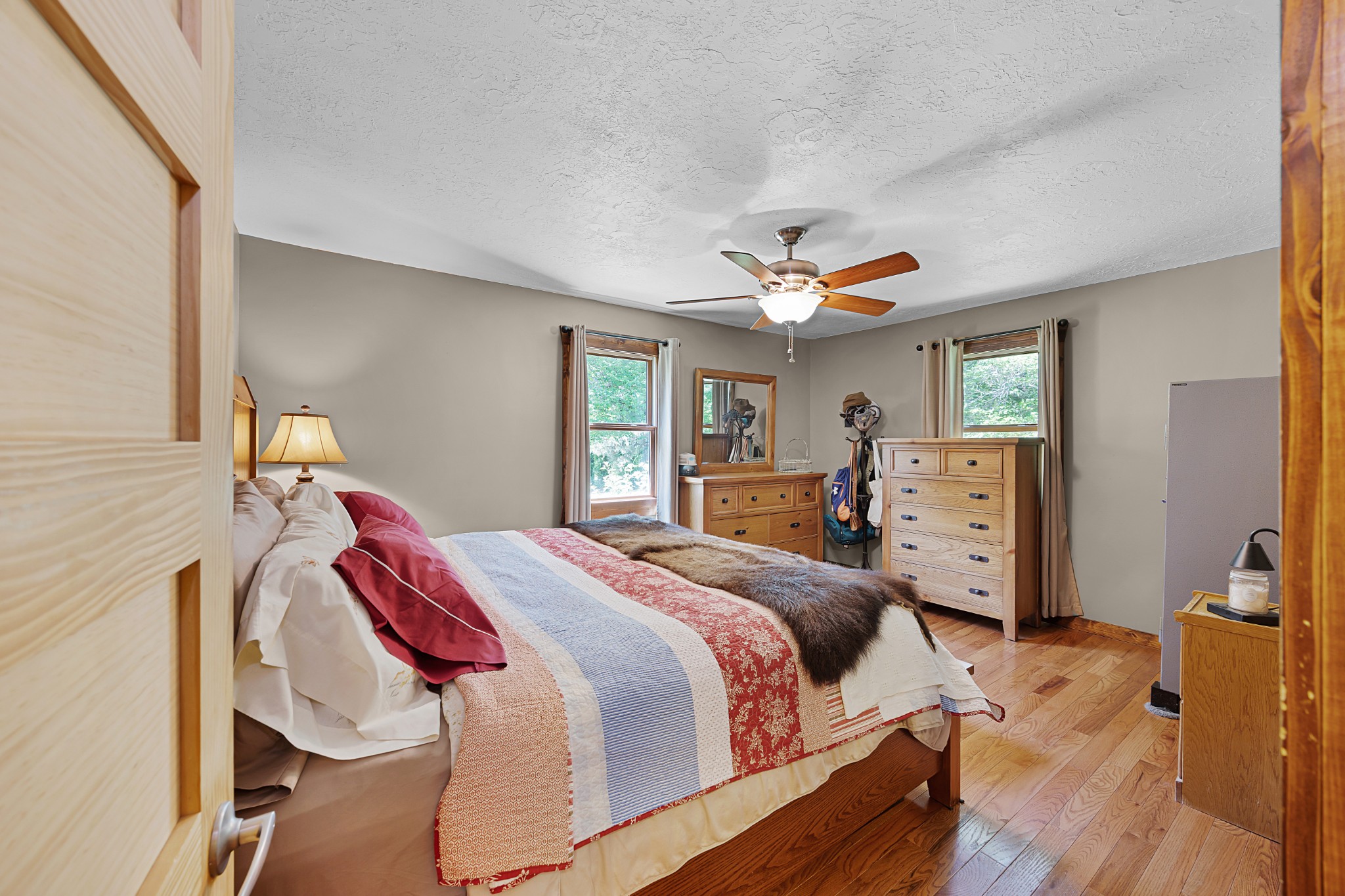 301 Killebrew Road Springville, TN 38256 - Photo 8 of 11 a bedroom with a bed and wooden floor
