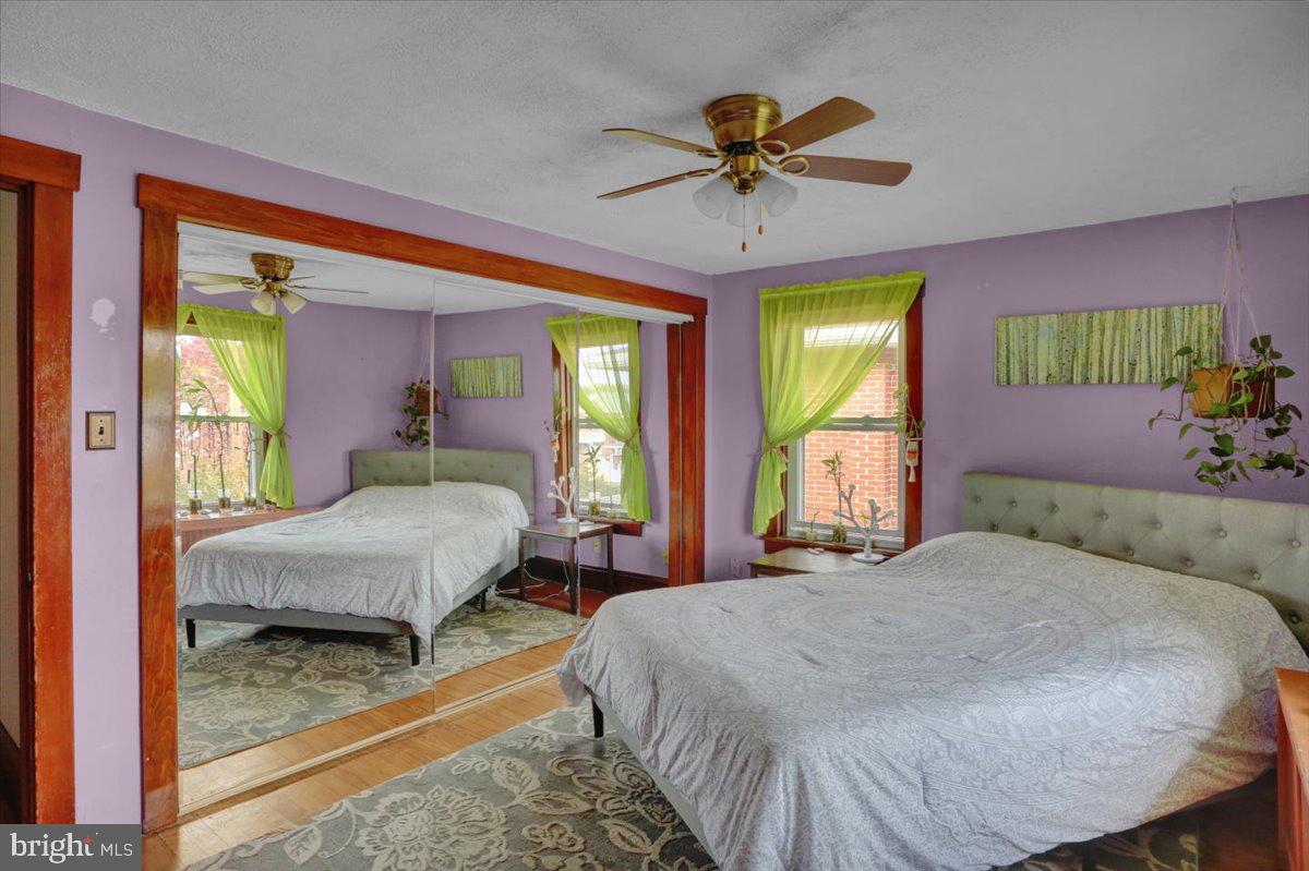 136 West Elm Street Reading, PA 19607 - Photo 18 of 23 a bedroom with a bed and a chandelier