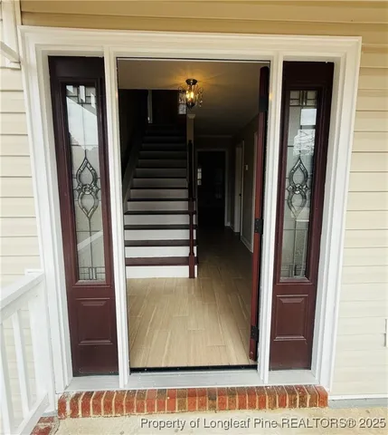 a view of empty room with a fireplace