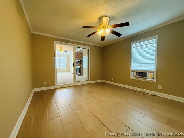 a view of a kitchen with refrigerator stove and wooden floor