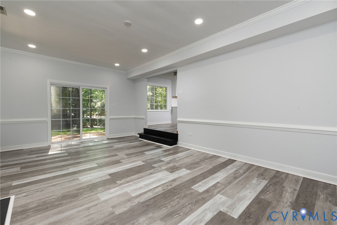 14011 Turtle Hill Road Midlothian, VA 23112 - Photo 16 of 34 a view of an empty room with wooden floor and a window