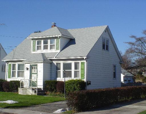 330 Riverside Drive Fairfield, CT 06824 - Photo 1 of 1 a front view of a house with a yard
