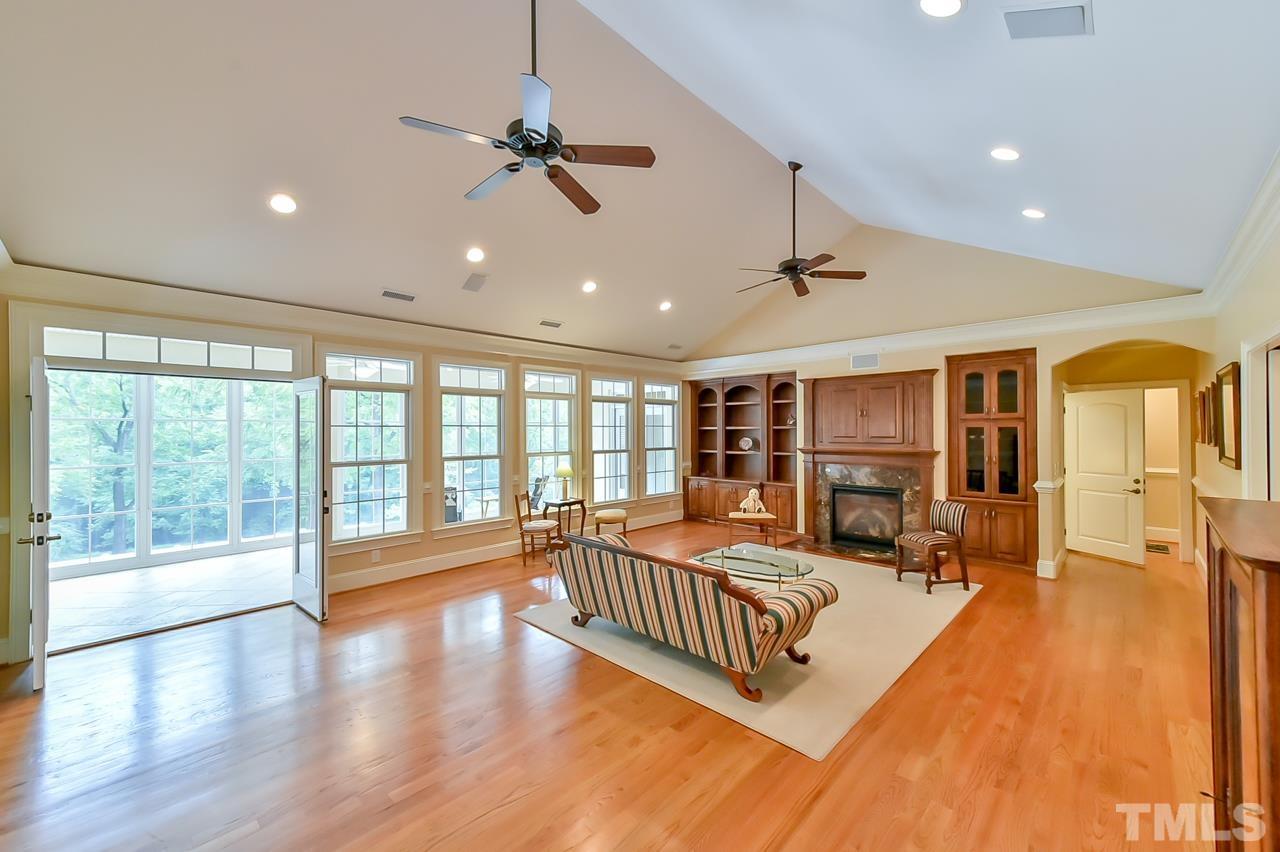 2734 River Forks Road Sanford, NC 27330 - Photo 15 of 30 a spacious bedroom with a large bed and a large window