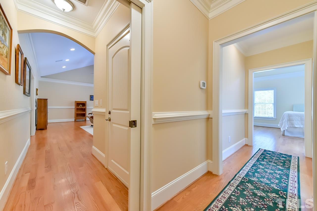 2734 River Forks Road Sanford, NC 27330 - Photo 16 of 30 a view of a hallway with wooden floor and furniture