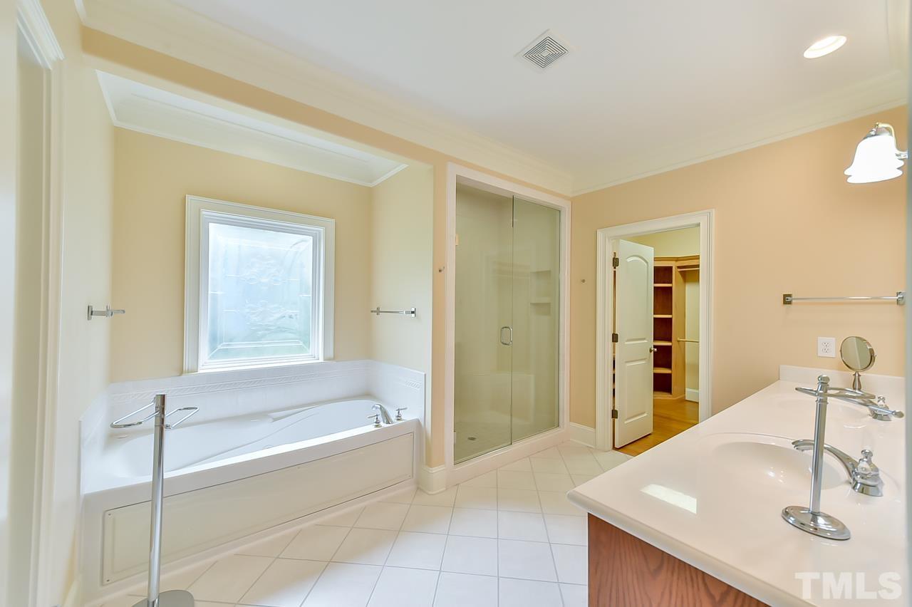 2734 River Forks Road Sanford, NC 27330 - Photo 17 of 30 a bathroom with a tub sink and mirror