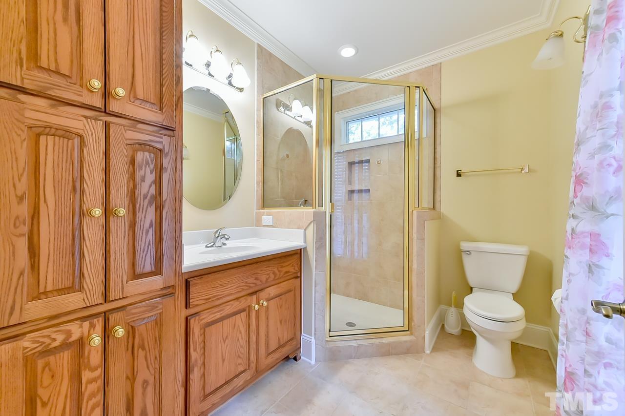 2734 River Forks Road Sanford, NC 27330 - Photo 20 of 30 a spacious bathroom with a granite countertop toilet sink and mirror