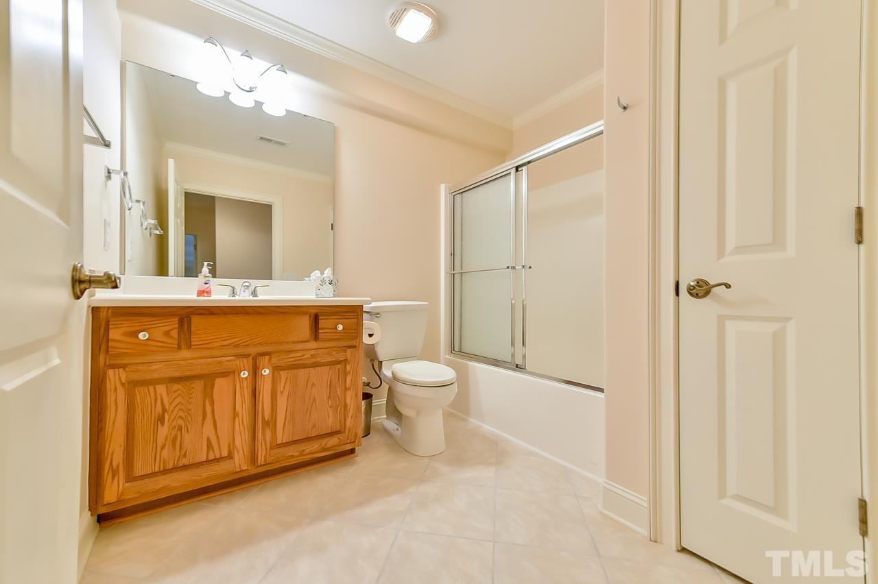 2734 River Forks Road Sanford, NC 27330 - Photo 22 of 30 a spacious bathroom with a granite countertop sink a toilet and a mirror
