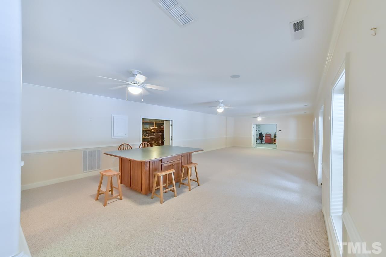 2734 River Forks Road Sanford, NC 27330 - Photo 24 of 30 a living room with furniture and a table