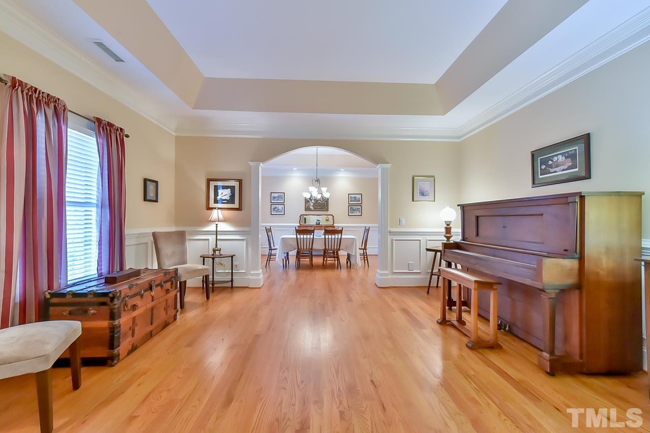 2734 River Forks Road Sanford, NC 27330 - Photo 5 of 30 a living room with furniture a wooden floor and a large window