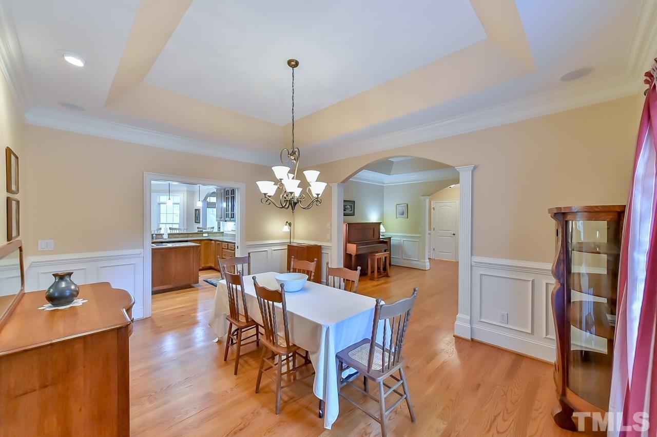 2734 River Forks Road Sanford, NC 27330 - Photo 6 of 30 a view of a dining room with furniture wooden floor and chandelier