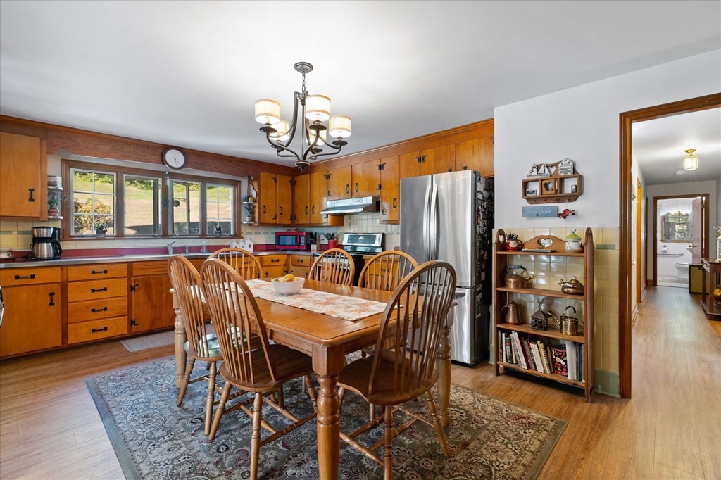 16 Main Street Sturbridge, MA 01566 - Photo 11 of 39 a view of a dining room with furniture window and wooden floor