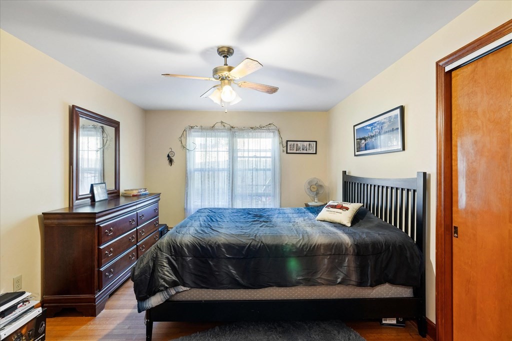 16 Main Street Sturbridge, MA 01566 - Photo 16 of 39 a bedroom with a bed and wooden floor