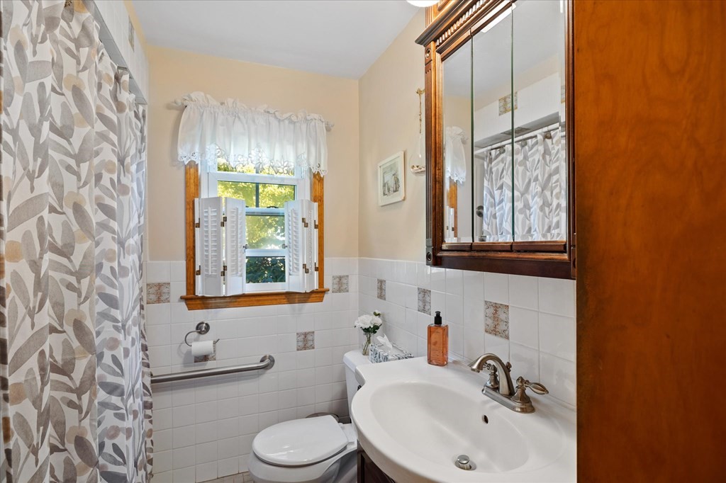16 Main Street Sturbridge, MA 01566 - Photo 20 of 39 a bathroom with a sink a toilet and a window