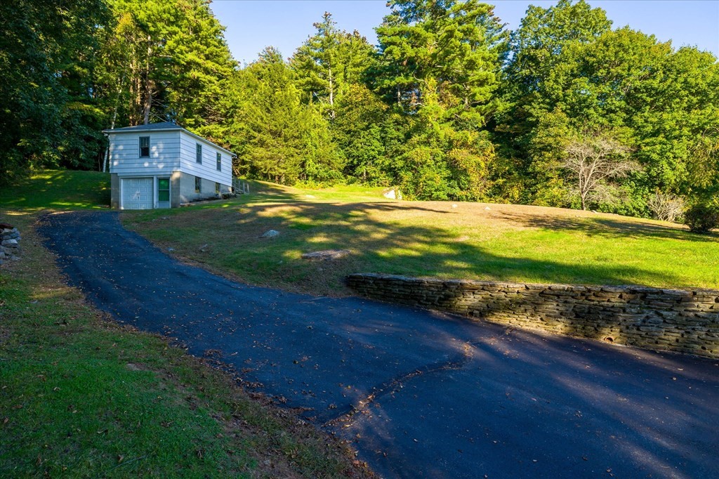 16 Main Street Sturbridge, MA 01566 - Photo 26 of 39 a view of a yard with an outdoor space