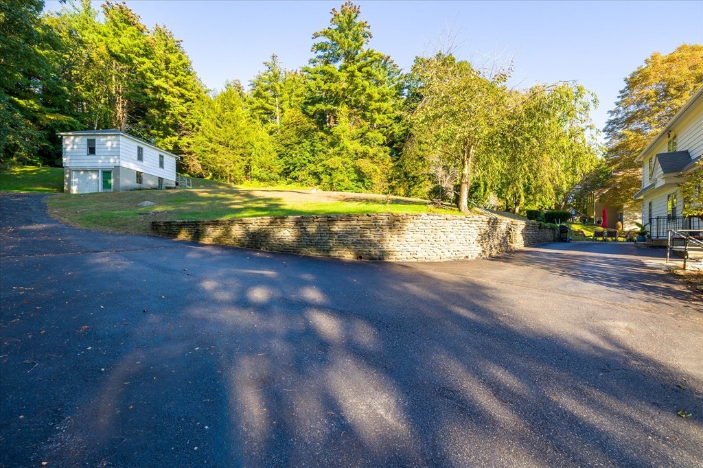16 Main Street Sturbridge, MA 01566 - Photo 29 of 39 a view of yard with swimming pool and green space