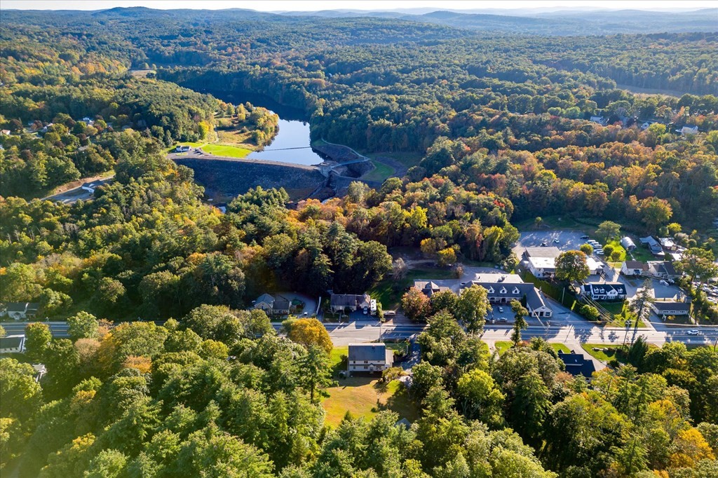16 Main Street Sturbridge, MA 01566 - Photo 35 of 39 an aerial view of residential houses with outdoor space and swimming pool