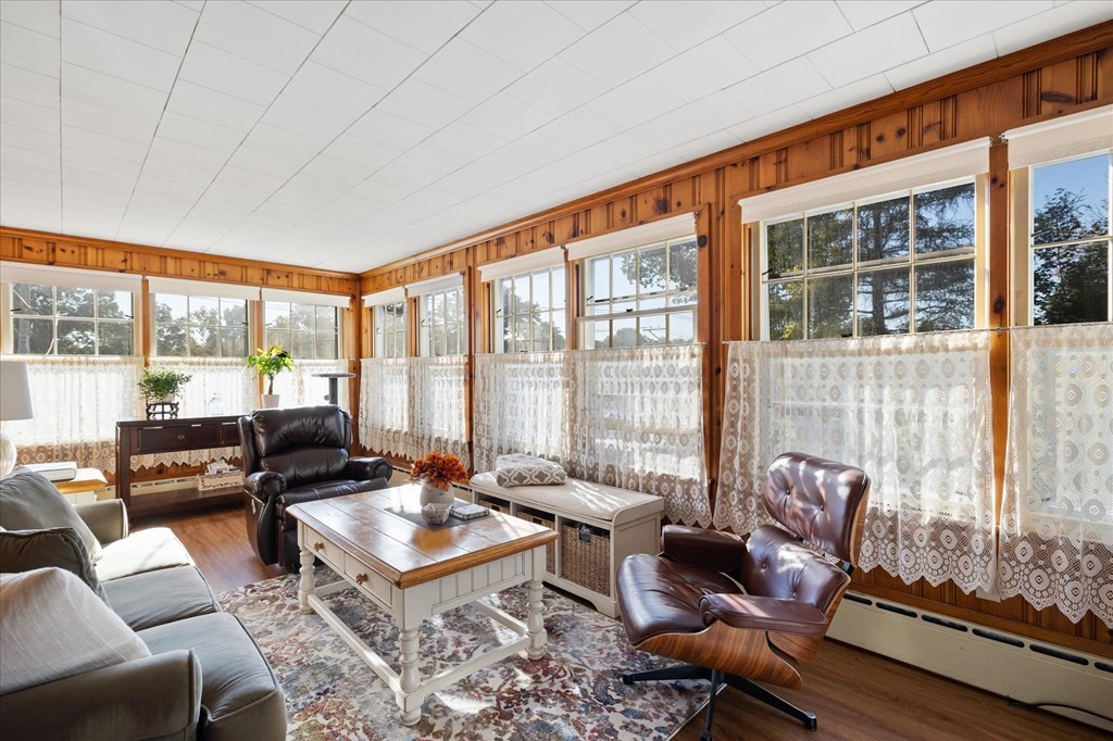 16 Main Street Sturbridge, MA 01566 - Photo 10 of 39 a living room with furniture and floor to ceiling windows