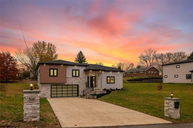 a front view of a house with garden