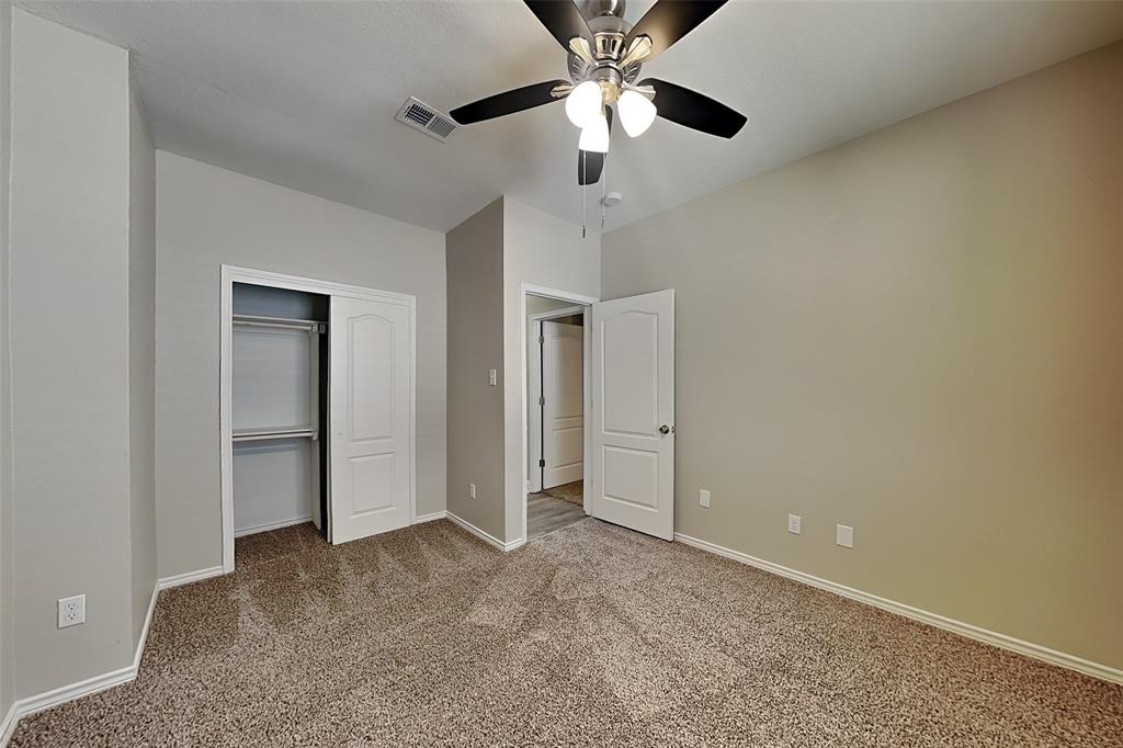 806 Kipling Drive Allen, TX 75002 - Photo 15 of 19 an empty room with a ceiling fan and a window